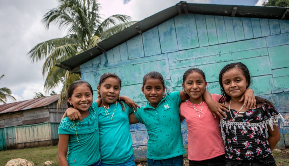 Students at the San Juan Villa Nueva School excitedly write their messages to their sponsors in the UK during Action Aid's annual message collection.