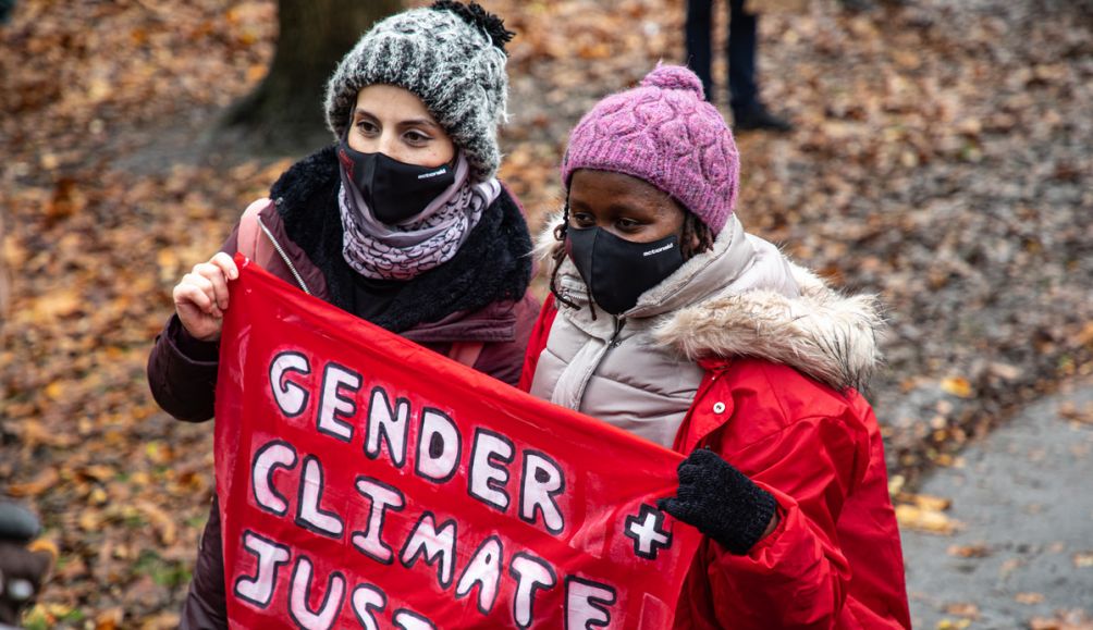 AActionAid's climate justice activists Monicah and Safa at the Global Day of Action for Climate Justice.