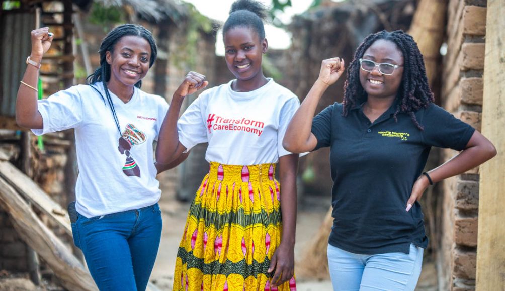 Eneless Hudson (centre), 25, is challenging austerity measures through the Mchinji Young Women Hub in Malawi.