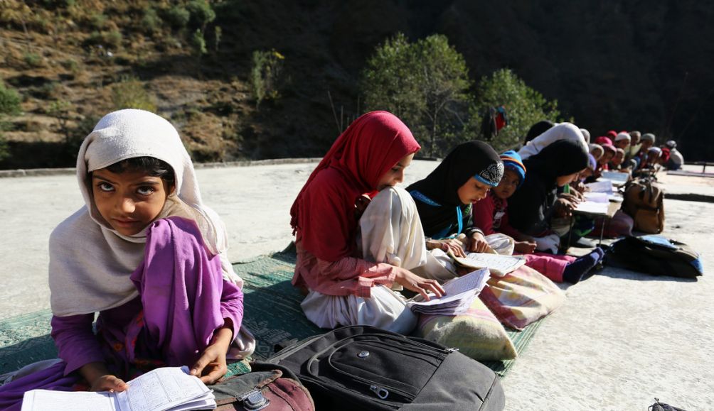 Muslim children of Gujjar community reads Quran at Maswari madarsa in India.