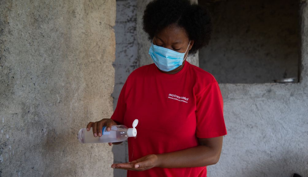 Mona 47, a nurse and women's network leader in Haiti, works to raise awareness about Covid-19 and its prevention in her community