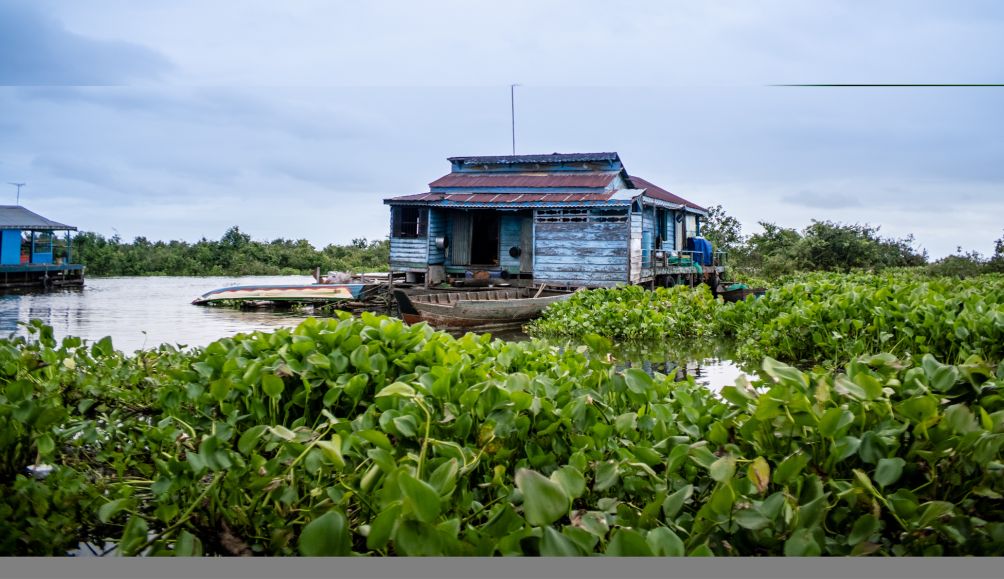 A house in a floating village in Pursat, Cambodia. The village also has a food processing station and a floating garden