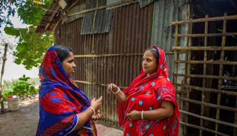 Two women talking to each other face to face