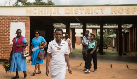Nurses in Malawi leaving a hospital and smiling