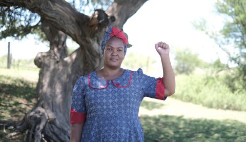 Woman holding up a fist in defiance