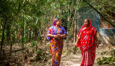 women walking and talking