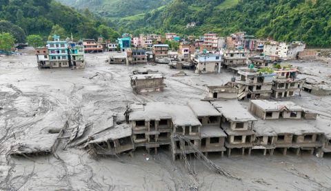 Aerial view showing residential buildings affected by the flash floods and landslide in Devighat, Bidur Municipality in Nepal's Nuwakot district.
