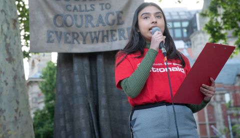 Community Campaigner speaking at podium