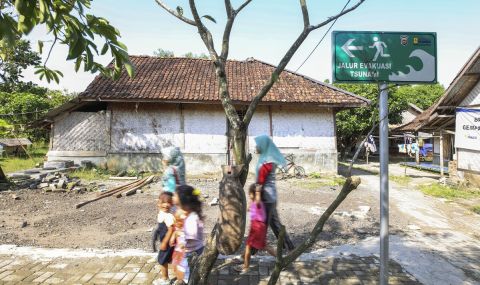Women and children evacuating a disaster zone