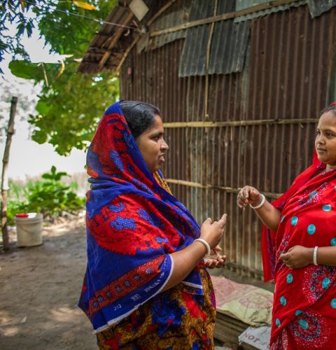 Two women talking to each other face to face
