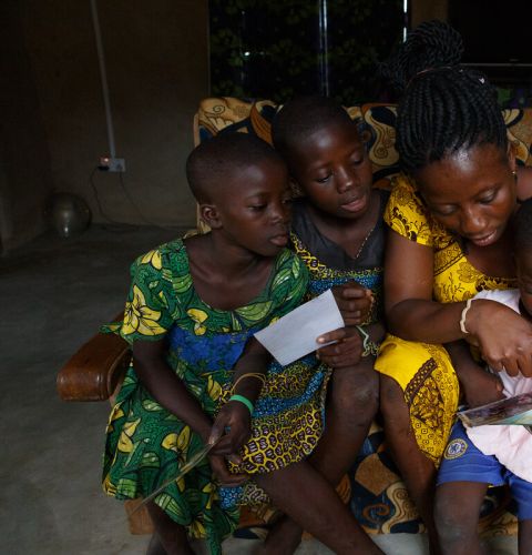 A family looking at old photos