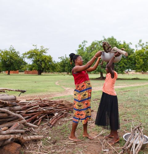 Woman helping a girl
