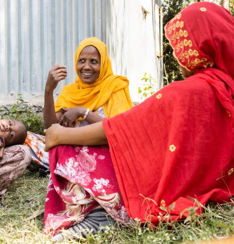Women sitting in a circle and talking