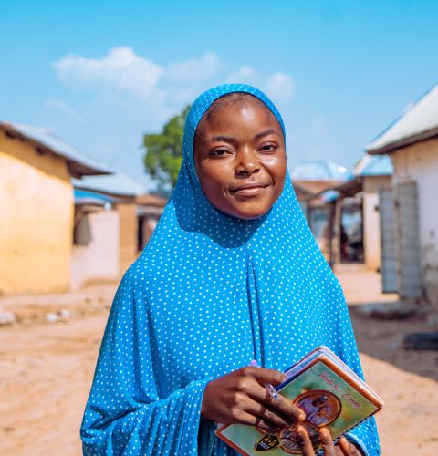 Girl holding a book in her hands