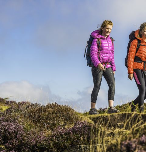 Two women climbing