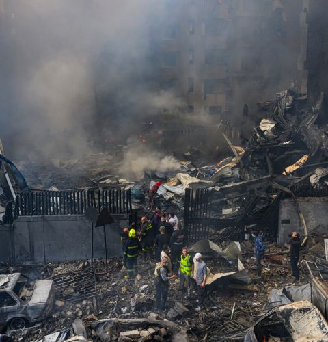 Emergency services looking for people in the rubble. 