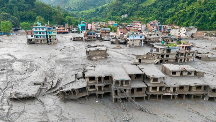 Aerial view showing residential buildings affected by the flash floods and landslide in Devighat, Bidur Municipality in Nepal's Nuwakot district. 