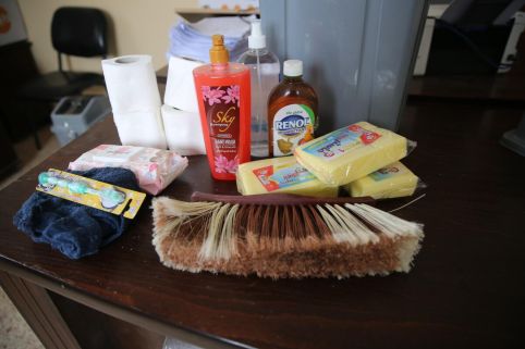 Closeup shot of items in an ActionAid hygiene kit containing soap, sponges, toothbrush etc.
