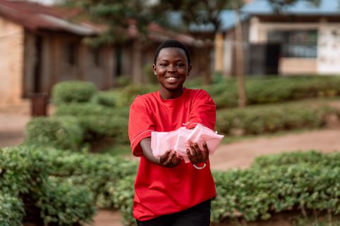 Girl holding up period pads